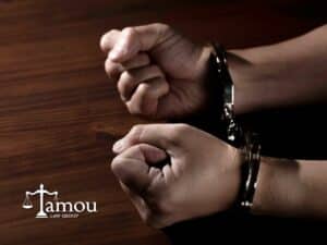 Handcuffed hands representing a case related to Dangerous Crimes Against Children in Arizona